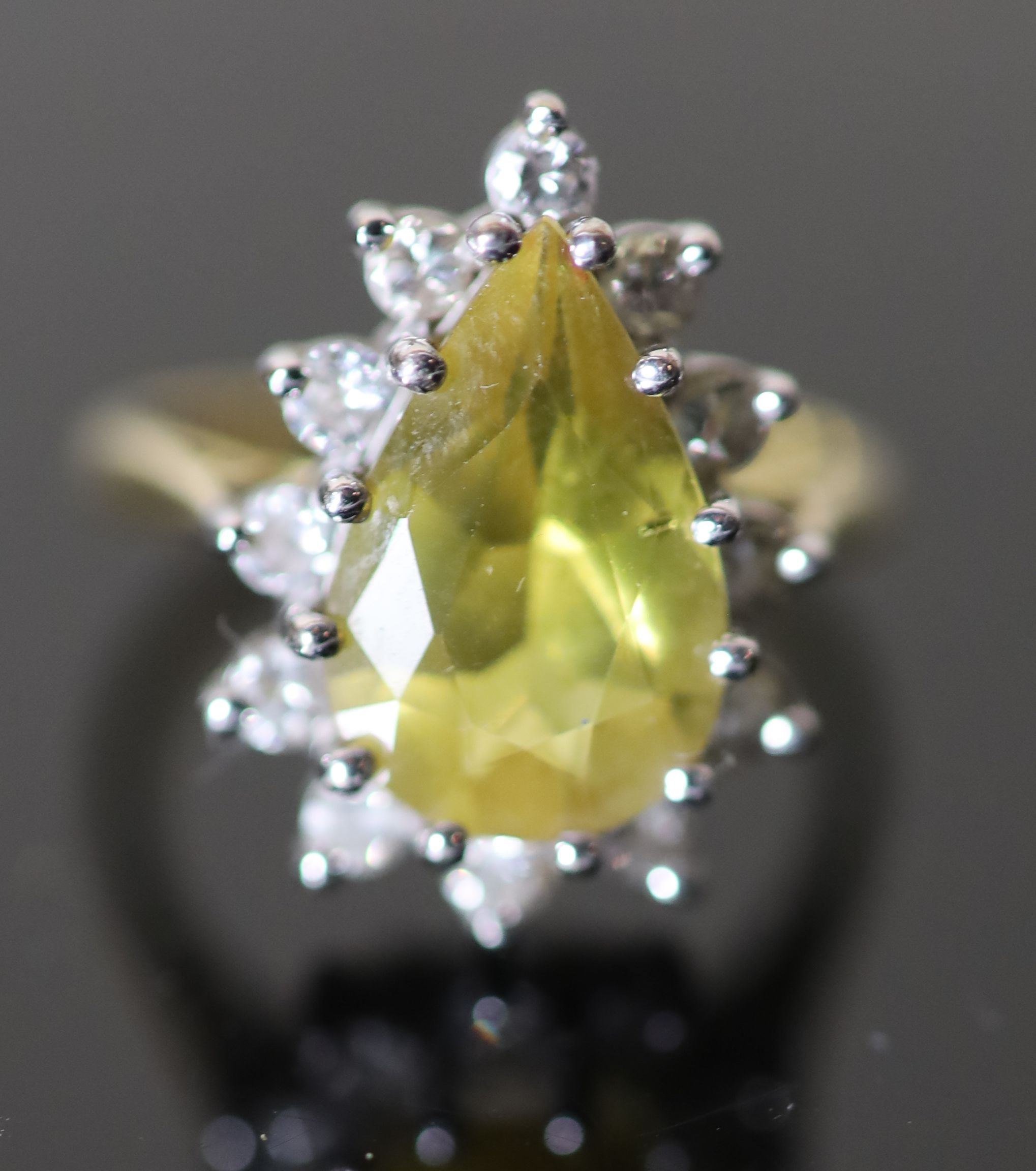 A modern 18ct gold, pear shaped yellow tourmaline and diamond set cluster dress ring,